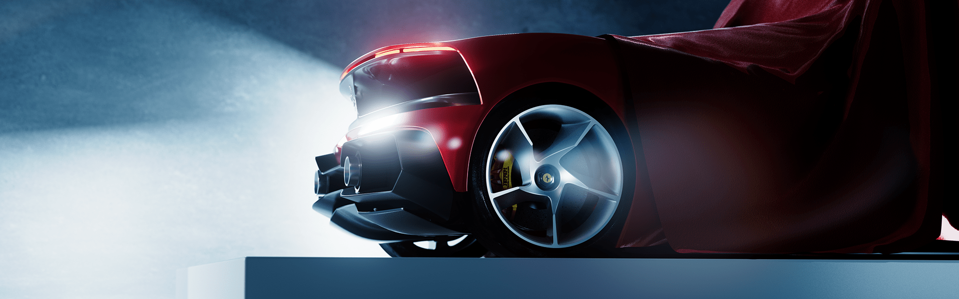 Partial rear reveal of the Ferrari Dino 806 GT concept beneath a red cloth