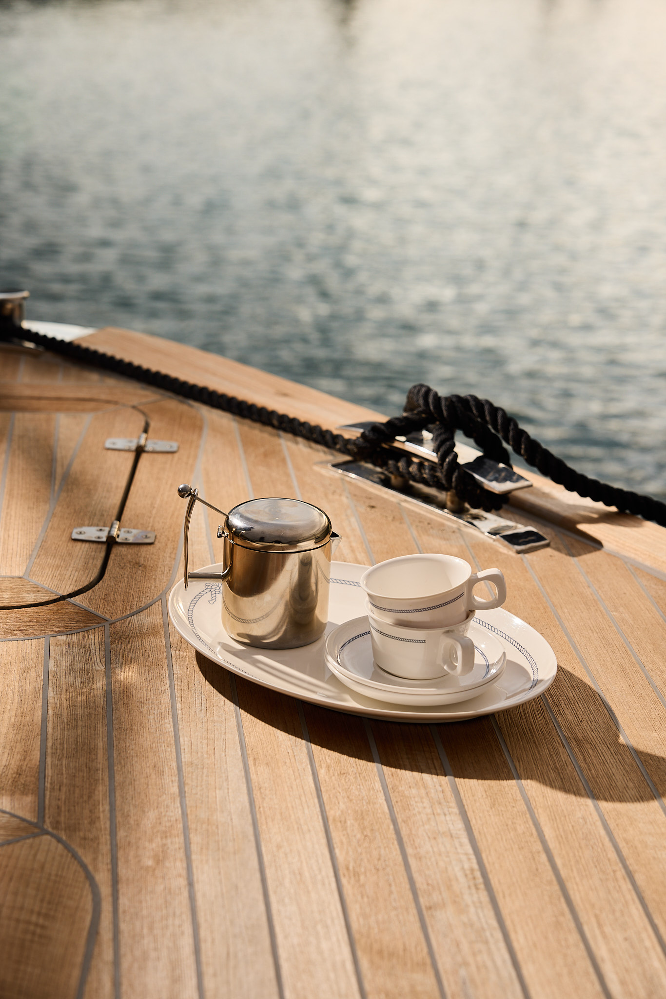 Margot moka coffee maker served with cups on the deck of a yacht