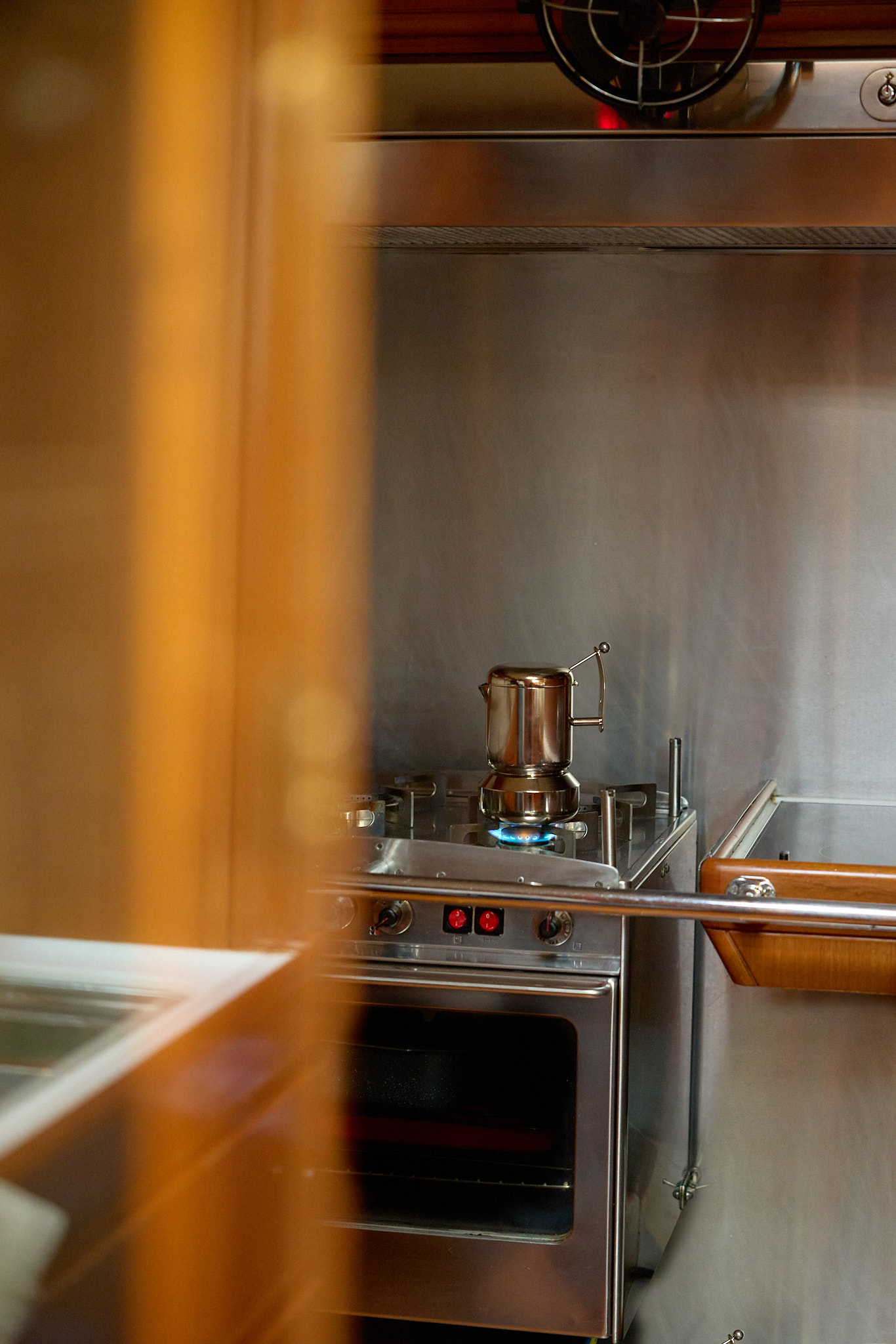 Margot stainless steel moka coffee maker heating on a gas stovetop