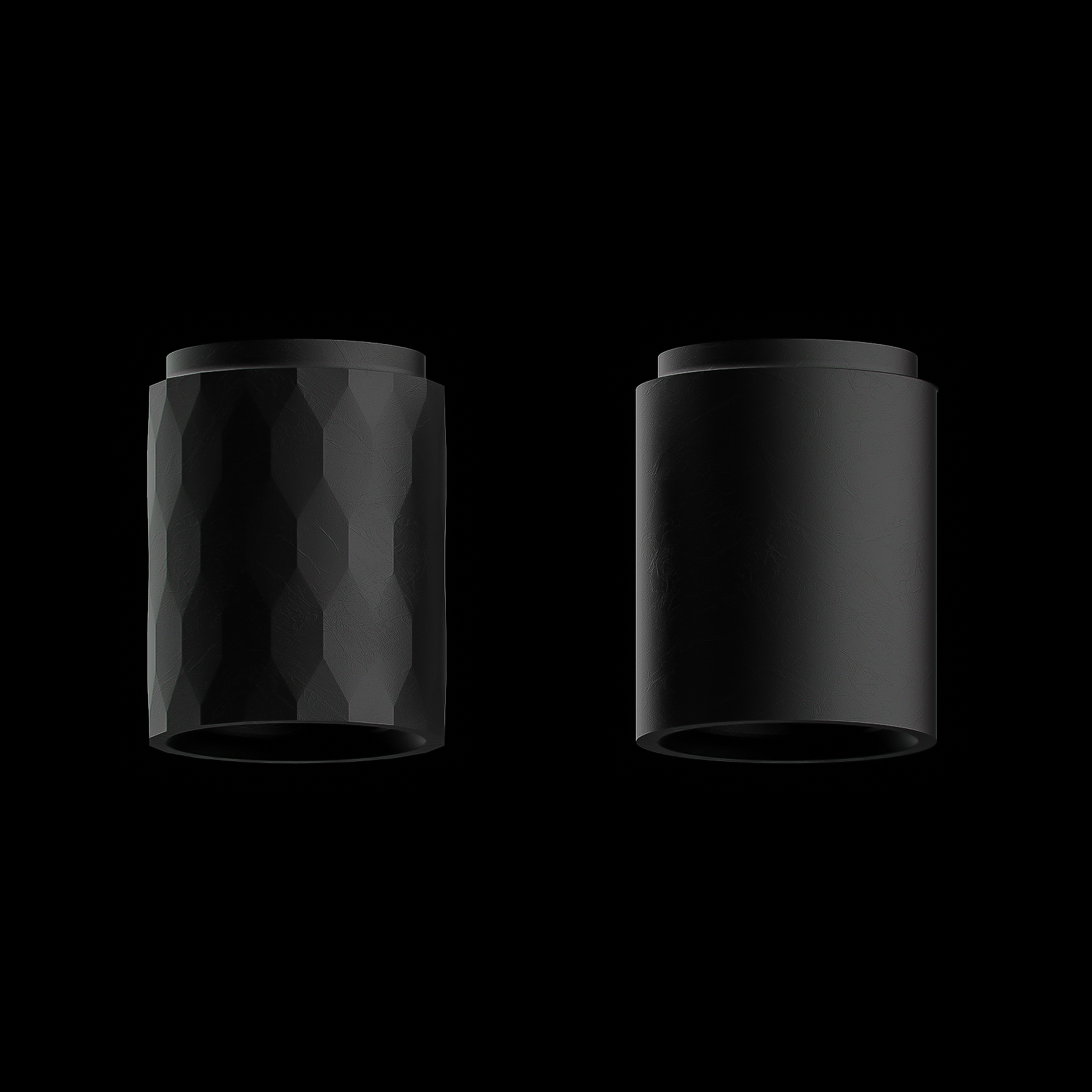 Two black Nebula handle concepts comparing faceted and smooth surface treatments