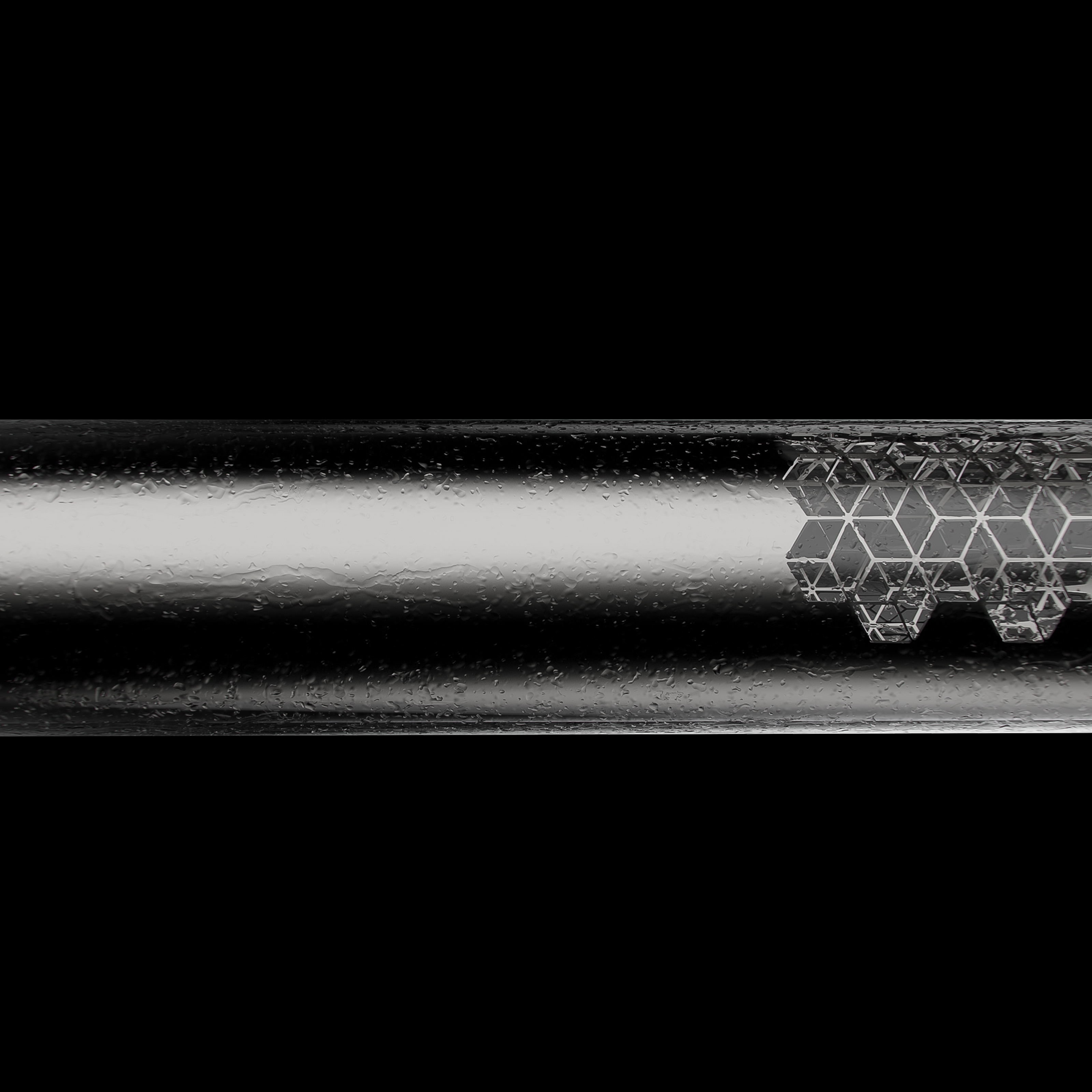 Close-up of the transparent Nebula chamber with condensation and an internal geometric engraving